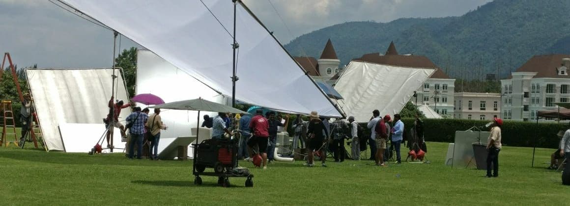 Cameraman filming with professional equipment